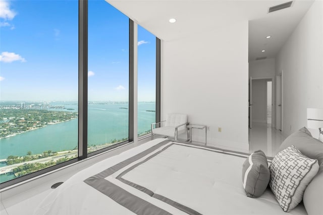3131 NE 7th Ave Unit Uph5303, Miami, FL 33137 - bedroom featuring a water view, expansive windows, and recessed lighting