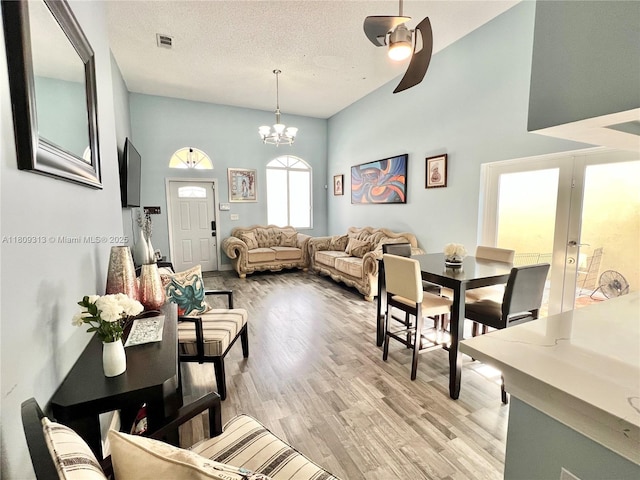 15333 SW 40th Ter, Miami, FL 33185 - living room with a ceiling fan, light wood finished floors, a chandelier, and french doors