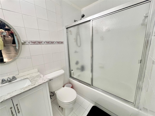 15333 SW 40th Ter, Miami, FL 33185 - full bath with tile walls, vanity, combined bath / shower with glass door, toilet, and tile patterned flooring