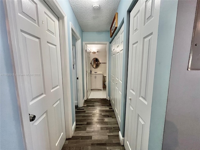 15333 SW 40th Ter, Miami, FL 33185 - hall with a textured ceiling and dark wood-style floors