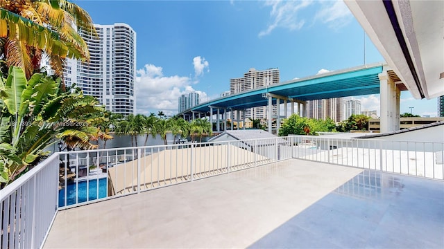 19140 N Bay Rd, Sunny Isles Beach, FL 33160 - view of community featuring a water view, a patio area, a pool, and a city view