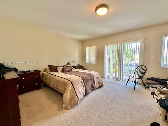 1945 N Hibiscus Dr, North Miami, FL 33181 - carpeted bedroom with access to exterior