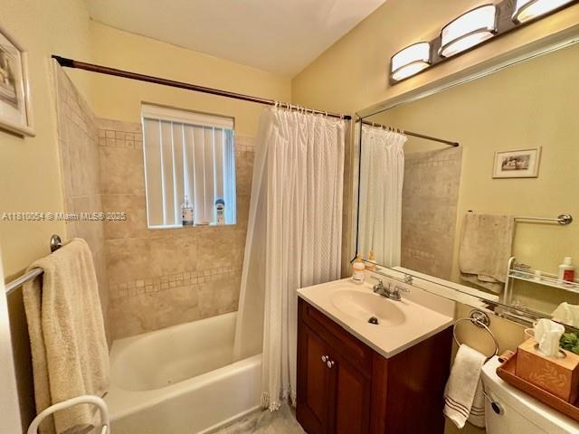 1945 N Hibiscus Dr, North Miami, FL 33181 - bathroom with shower / bath combo with shower curtain, vanity, and toilet