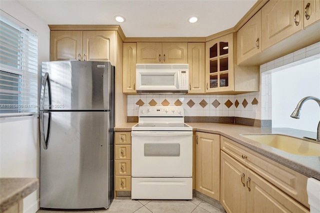 9450 Poinciana Pl Unit 212, Davie, FL 33324 - kitchen with white appliances, a sink, light brown cabinets, and recessed lighting