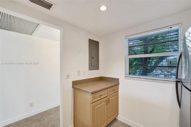 9450 Poinciana Pl Unit 212, Davie, FL 33324 - kitchen featuring electric panel, freestanding refrigerator, baseboards, light brown cabinetry, and recessed lighting