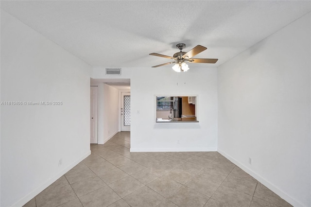 9450 Poinciana Pl Unit 212, Davie, FL 33324 - unfurnished living room featuring a ceiling fan, light tile patterned floors, a textured ceiling, and baseboards