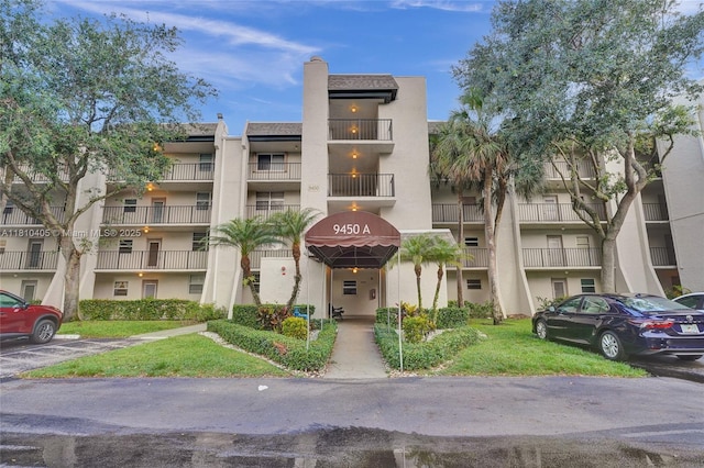 9450 Poinciana Pl Unit 212, Davie, FL 33324 - view of apartment building / complex with uncovered parking