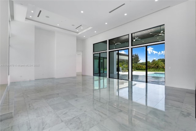 12331 SW 2nd St, Plantation, FL 33325 - unfurnished room featuring a high ceiling, marble tiled floors, recessed lighting, ceiling fan, and a raised ceiling