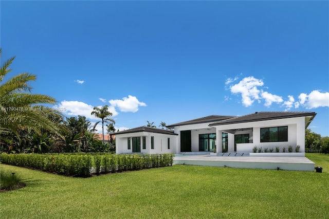 12331 SW 2nd St, Plantation, FL 33325 - rear view of house featuring a lawn and stucco siding