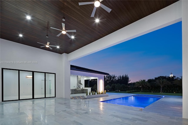 12331 SW 2nd St, Plantation, FL 33325 - swimming pool with ceiling fan, an outdoor kitchen, and a patio