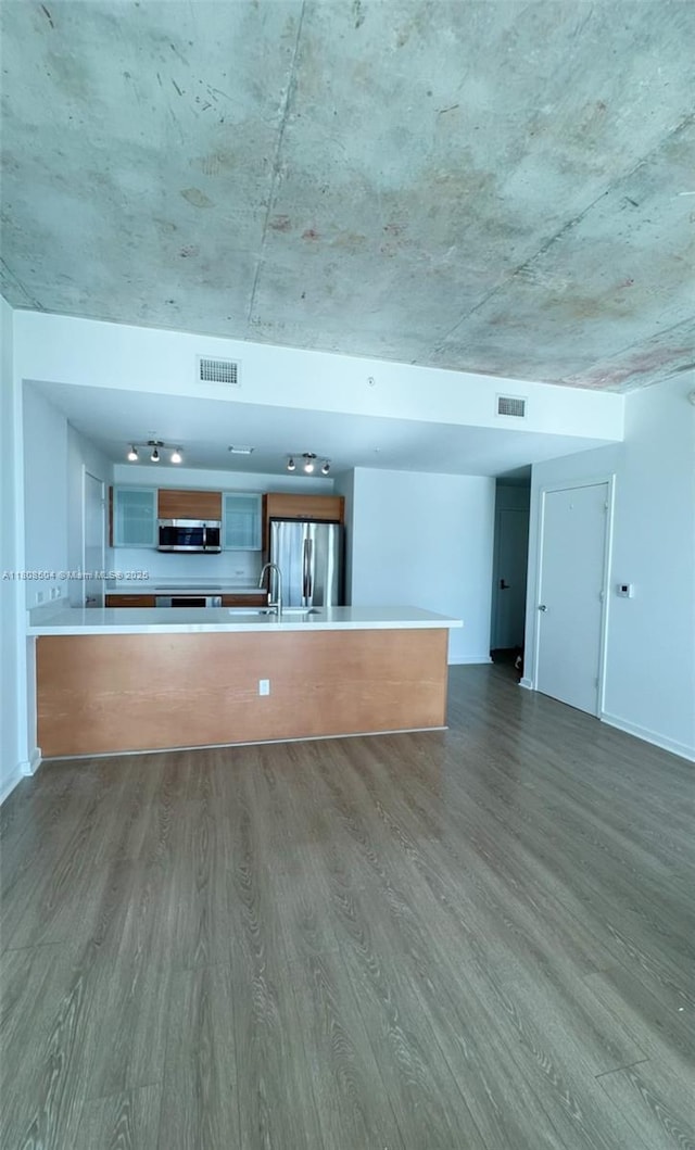 3301 NE 1st Ave Unit H2304, Miami, FL 33137 - unfurnished living room with dark wood-style flooring, a sink, and baseboards