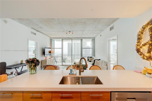 3301 NE 1st Ave Unit H2304, Miami, FL 33137 - kitchen with open floor plan, stainless steel dishwasher, and light countertops