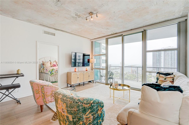 3301 NE 1st Ave Unit H2304, Miami, FL 33137 - living room featuring wood finished floors and expansive windows