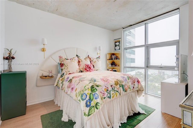 3301 NE 1st Ave Unit H2304, Miami, FL 33137 - bedroom featuring wood finished floors and floor to ceiling windows