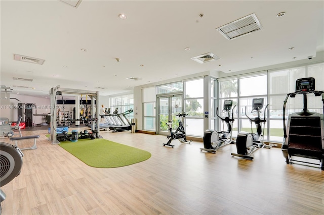 3301 NE 1st Ave Unit H2304, Miami, FL 33137 - gym featuring wood finished floors and a wall of windows