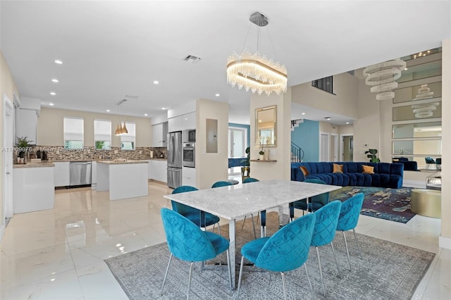1930 SW 12th Ave, Miami, FL 33129 - dining space featuring a chandelier, recessed lighting, and light marble finish flooring