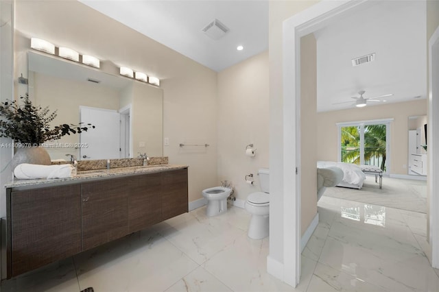 1930 SW 12th Ave, Miami, FL 33129 - ensuite bathroom with a bidet, marble finish floors, double vanity, baseboards, and toilet