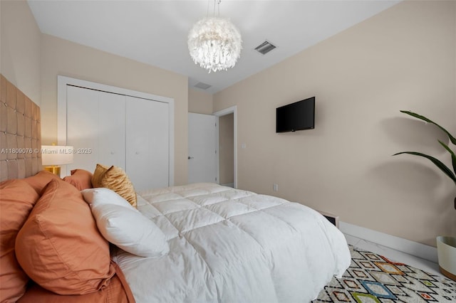 1930 SW 12th Ave, Miami, FL 33129 - bedroom with a chandelier, a closet, and baseboards