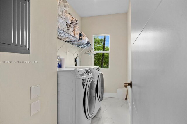 1930 SW 12th Ave, Miami, FL 33129 - washroom featuring washing machine and dryer, marble look tiles, and baseboards