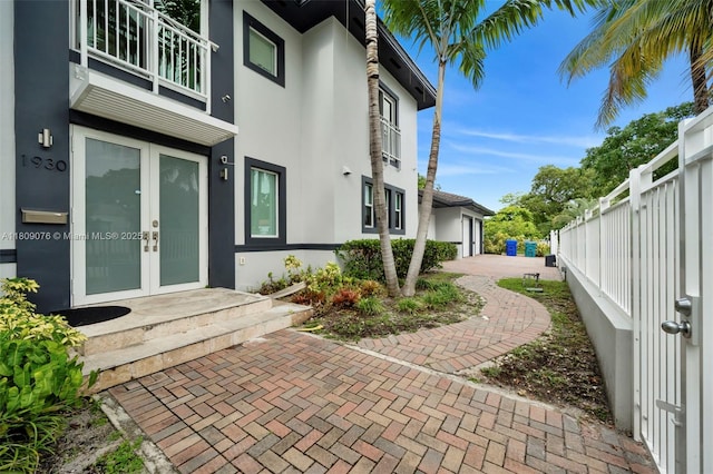 1930 SW 12th Ave, Miami, FL 33129 - entrance to property featuring french doors, stucco siding, and a balcony