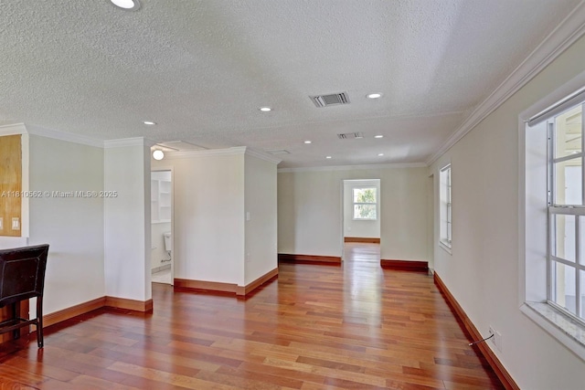 5156 Hartwick Ln, West Palm Beach, FL 33415 - empty room with wood finished floors, a textured ceiling, baseboards, recessed lighting, and ornamental molding