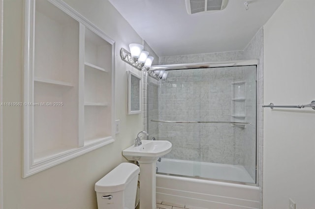 5156 Hartwick Ln, West Palm Beach, FL 33415 - bathroom with bath / shower combo with glass door and toilet