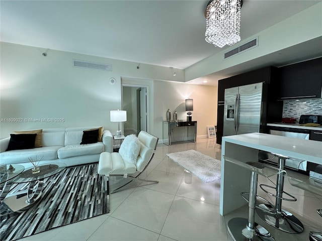 950 Brickell Bay Dr Unit 2607, Miami, FL 33131 - living area featuring light tile patterned floors and a chandelier