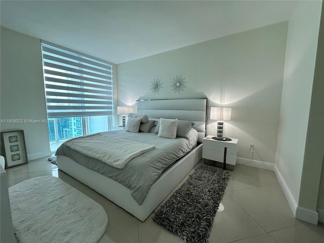 950 Brickell Bay Dr Unit 2607, Miami, FL 33131 - tiled bedroom with floor to ceiling windows and baseboards