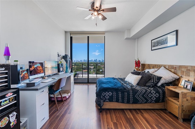 1300 Ponce De Leon Blvd Unit 705, Coral Gables, FL 33134 - bedroom with access to outside, a desk, wood finished floors, and expansive windows