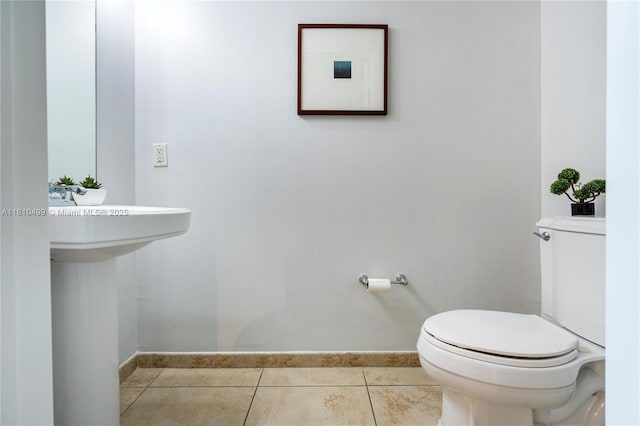 1300 Ponce De Leon Blvd Unit 705, Coral Gables, FL 33134 - half bathroom with toilet, tile patterned flooring, and baseboards