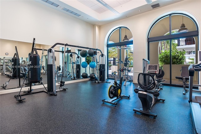 1300 Ponce De Leon Blvd Unit 705, Coral Gables, FL 33134 - exercise room featuring plenty of natural light and a towering ceiling
