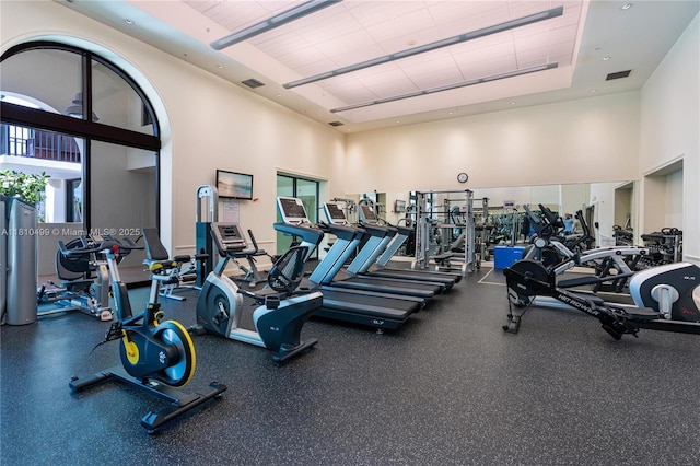 1300 Ponce De Leon Blvd Unit 705, Coral Gables, FL 33134 - gym with a towering ceiling and a tray ceiling