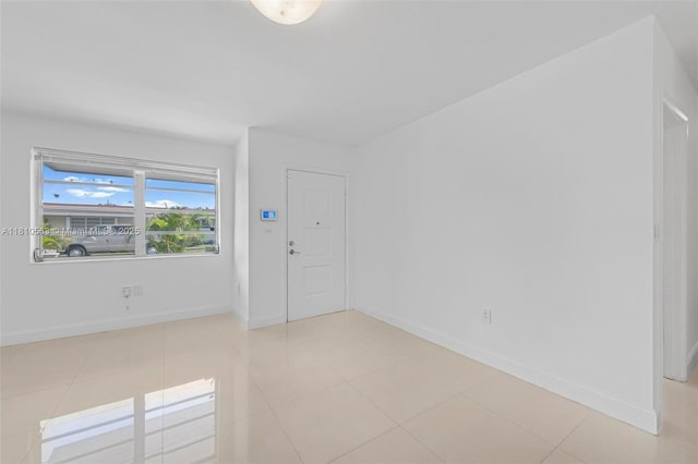 3202 SW 3rd St, Miami, FL 33135 - foyer entrance with baseboards and light tile patterned floors