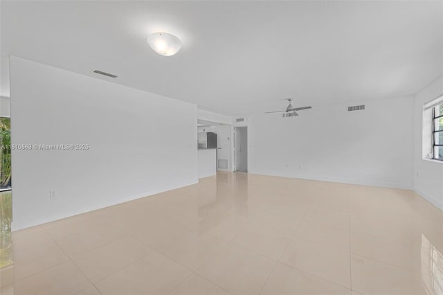 3202 SW 3rd St, Miami, FL 33135 - spare room featuring a ceiling fan, light tile patterned floors, and baseboards