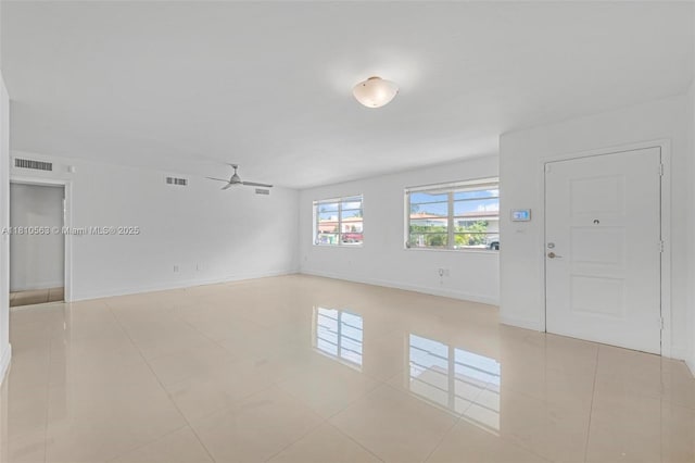 3202 SW 3rd St, Miami, FL 33135 - spare room featuring ceiling fan, light tile patterned floors, and baseboards