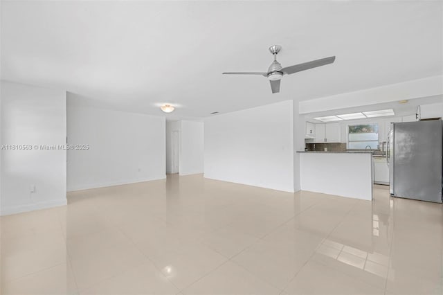 3202 SW 3rd St, Miami, FL 33135 - unfurnished living room featuring a ceiling fan and light tile patterned floors
