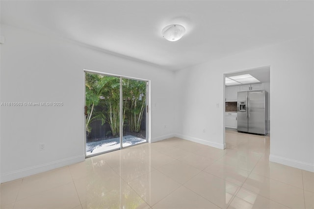 3202 SW 3rd St, Miami, FL 33135 - spare room with baseboards and light tile patterned floors
