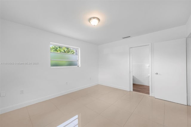 3202 SW 3rd St, Miami, FL 33135 - unfurnished bedroom with baseboards and light tile patterned floors