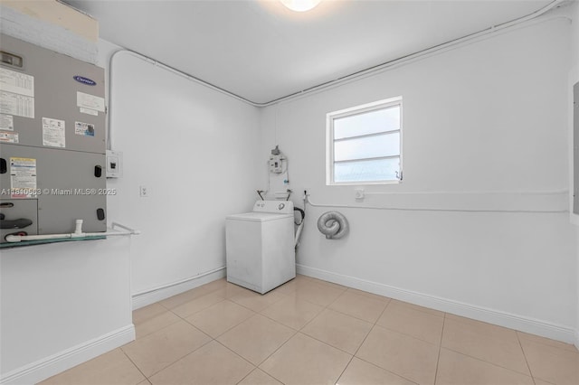 3202 SW 3rd St, Miami, FL 33135 - laundry room featuring washer / dryer, baseboards, heating unit, and light tile patterned floors