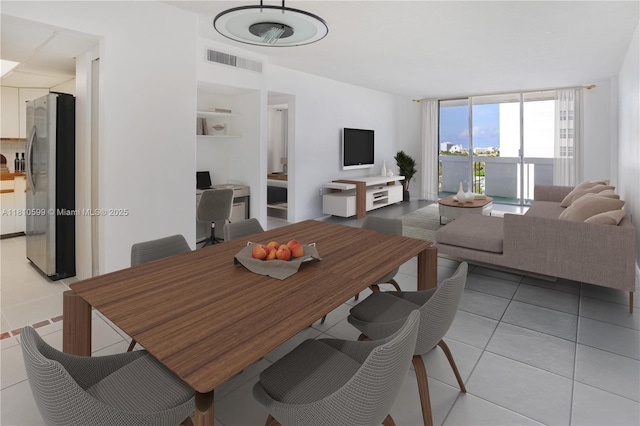 800 W Ave Unit 920, Miami Beach, FL 33139 - dining room featuring light tile patterned floors and floor to ceiling windows
