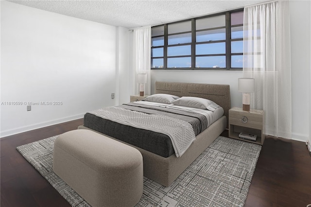 800 W Ave Unit 920, Miami Beach, FL 33139 - bedroom featuring wood finished floors, baseboards, and a textured ceiling