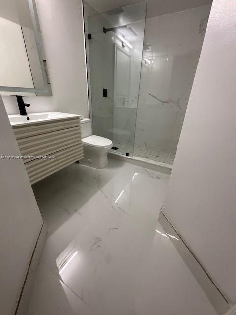 15221 SW 80th St Unit 201, Miami, FL 33193 - full bath with marble finish floors, a shower stall, vanity, and toilet