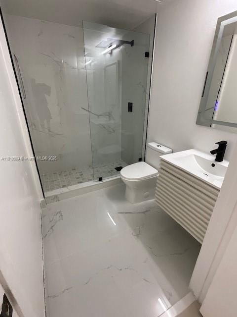 15221 SW 80th St Unit 201, Miami, FL 33193 - bathroom with marble finish flooring, toilet, a marble finish shower, and vanity