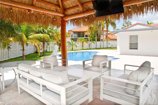 1328 NW 93rd Ter, Coral Springs, FL 33071 - view of pool with a fenced backyard, an outdoor living space, a patio, and a gazebo