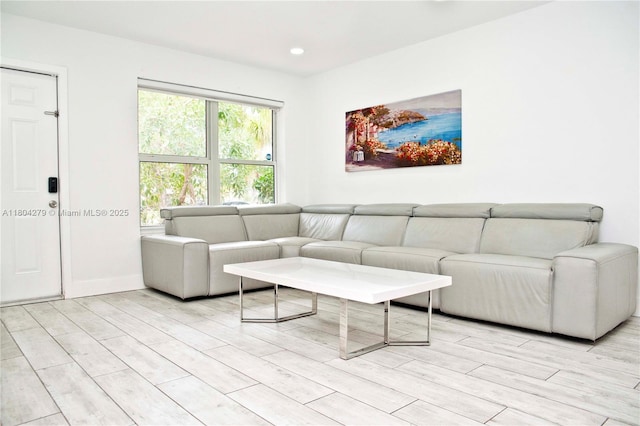 1328 NW 93rd Ter, Coral Springs, FL 33071 - living area featuring light wood-style floors, baseboards, and recessed lighting