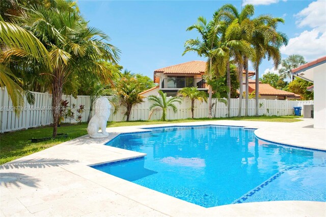 1328 NW 93rd Ter, Coral Springs, FL 33071 - view of swimming pool with a fenced backyard and a patio area