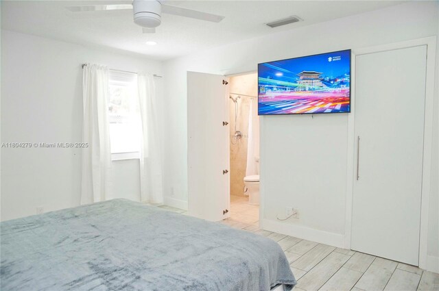 1328 NW 93rd Ter, Coral Springs, FL 33071 - bedroom with baseboards, ensuite bathroom, and a ceiling fan