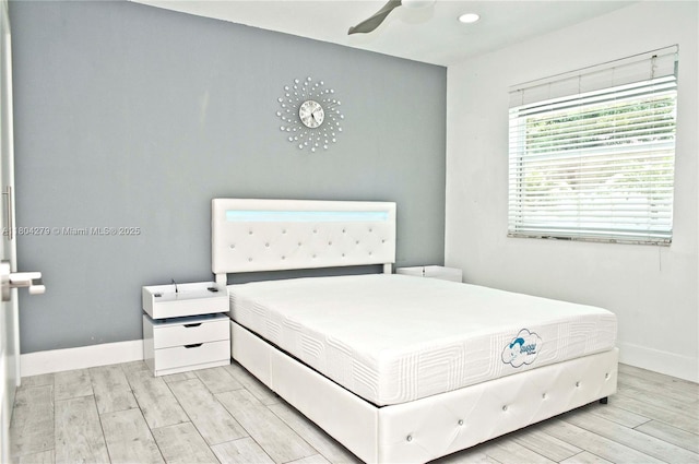 1328 NW 93rd Ter, Coral Springs, FL 33071 - bedroom featuring light wood-type flooring, baseboards, and a ceiling fan