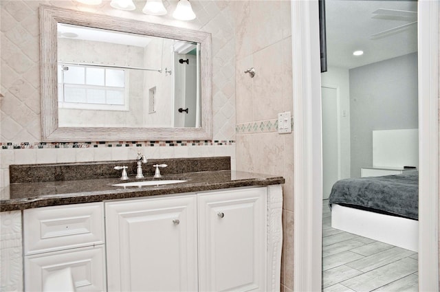 1328 NW 93rd Ter, Coral Springs, FL 33071 - ensuite bathroom with tile walls, vanity, and a shower