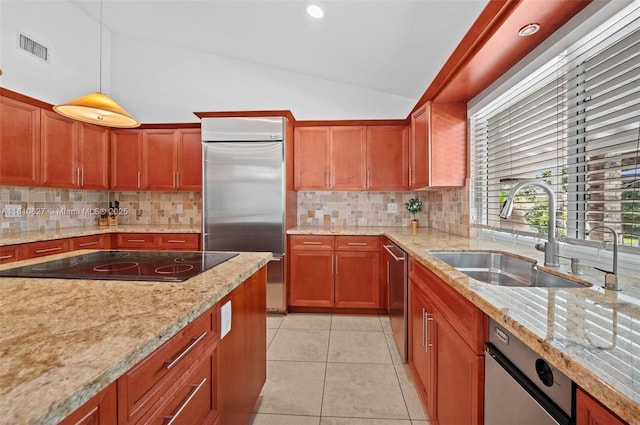 7350 SW 154th Ter, Palmetto Bay, FL 33157 - kitchen featuring appliances with stainless steel finishes, a sink, lofted ceiling, backsplash, and pendant lighting